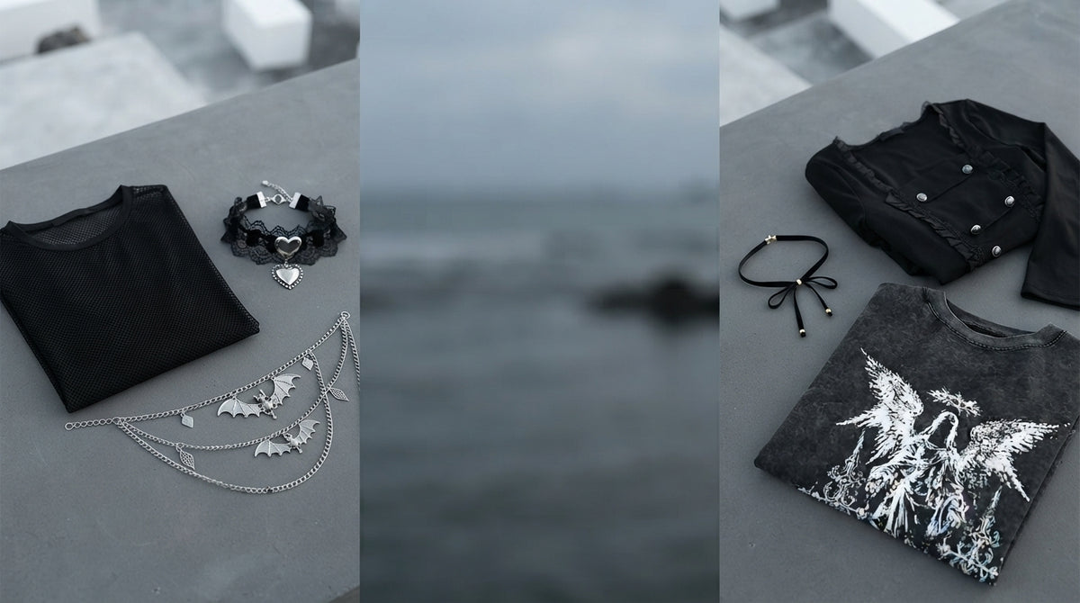 A collection of gothic accessories and clothing arranged on a dark surface in a professional, minimalist editorial setting.